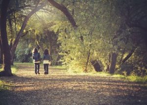 Girls Walking Through Trees | Heidi McBain, Women's Counselor & Online Therapist in Flower Mound, Texas