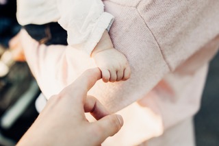 Baby's hand grasping an adult's finger | | Heidi McBain, Women's Counselor & Online Therapist in Flower Mound, Texas
